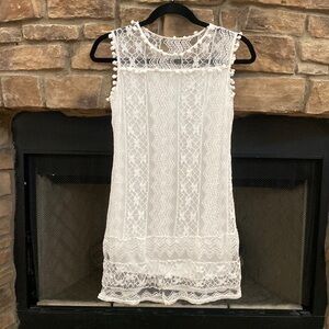 NWOT Gulang white lace sleeveless dress with Pom Pom detail. Size small